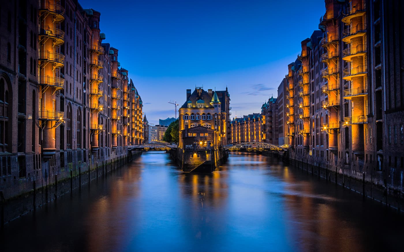 A canal city glowing at dusk.